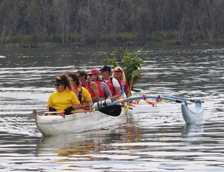 A crew of paddlers in an OC6